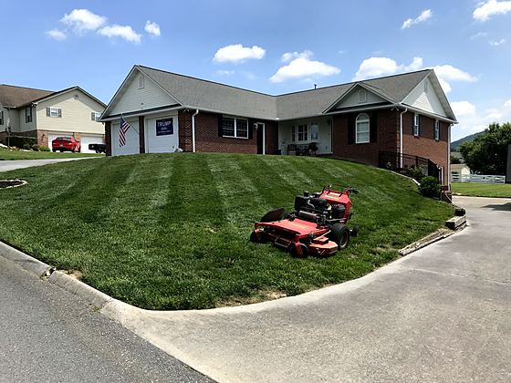 Hillside mowing on a summer route
